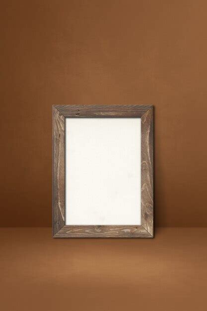 Premium Photo Wooden Picture Frame Leaning On A Brown Wall Blank