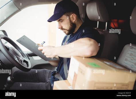 Delivery Man Sitting In His Van Stock Photo Alamy