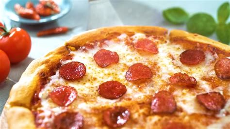 Premium Photo Pizza With Salami And Tomatoes