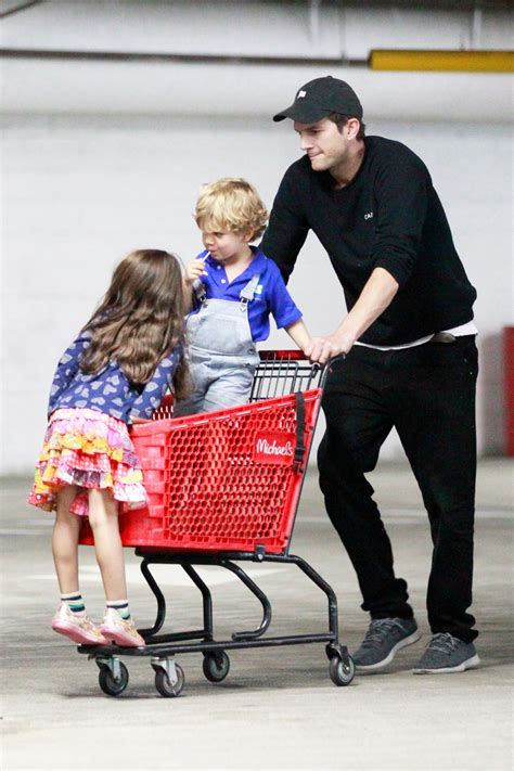 Ashton Kutcher Pushes His Kids in a Cart While Shopping