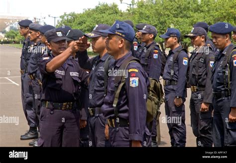 Indonesian police officers in central Jakarta practising marching and saluting, Indonesia Stock ...