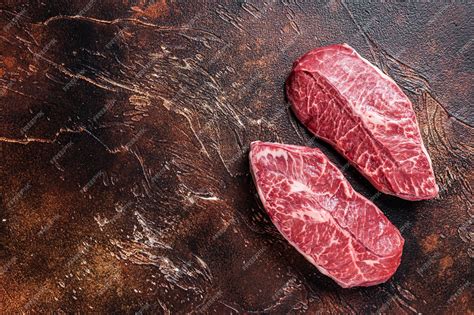 Premium Photo Raw Top Blade Or Flat Iron Beef Meat Steaks On A Butcher Table Dark Background