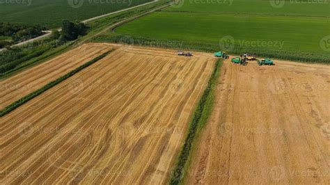 Harvesting barley harvesters. Fields of wheat and barley, the work of ...