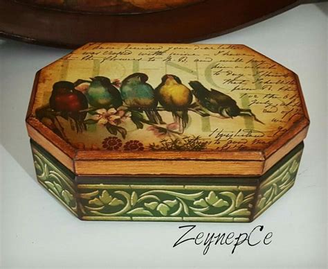 A Decorative Box With Birds Painted On It