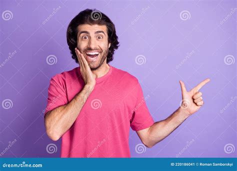 Photo Of Funny Pretty Young Guy Dressed Pink Outfit Pointing Finger Empty Space Isolated Purple