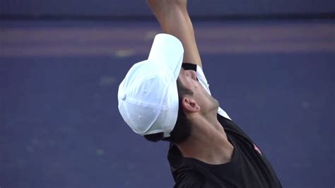 Novak Djokovic Serve In Super Slow Motion Form Back Perspective Bnp