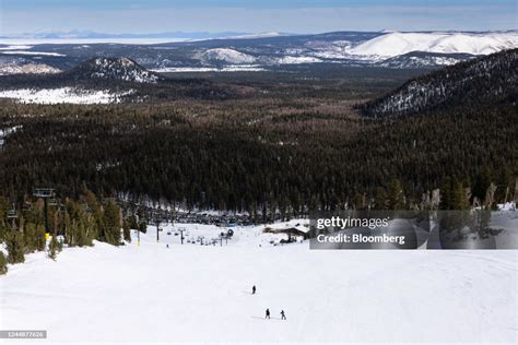 Skiers at Mammoth Mountain in Mammoth Lakes, California, US, on... News ...