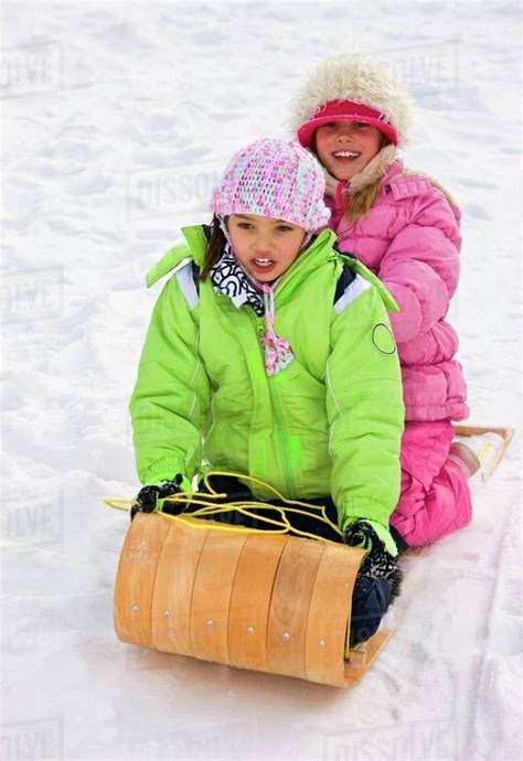 Children Tobogganing Stock Photo Dissolve