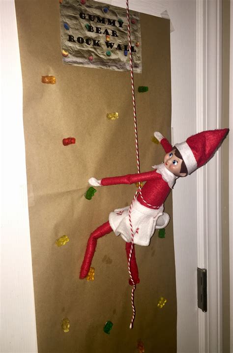 Elf On The Shelf Day 31 Jingle Bell Is Scaling A Gummy Bear Rock