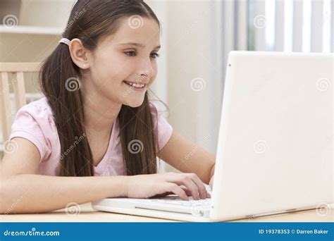 Girl Child Using Laptop Computer At Home Stock Image Image Of