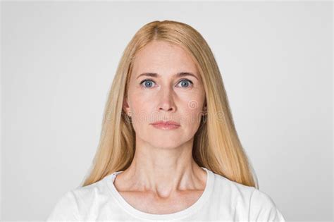 Woman With Blonde Hair Looking Directly At Camera Closeup Stock Image