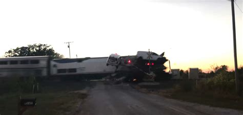 Dramatic Video Shows Amtrak Train Slamming Into Semi Truck Car Hauler