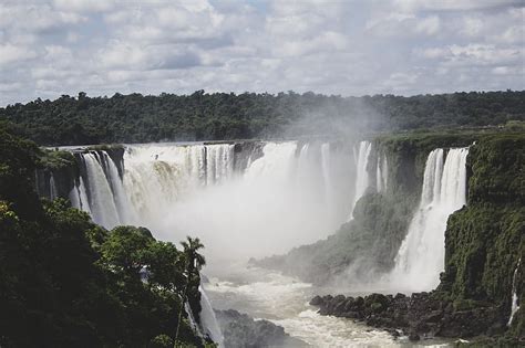 Waterfalls Under White Clouds And Blue Sky During Daytime Hd Wallpaper