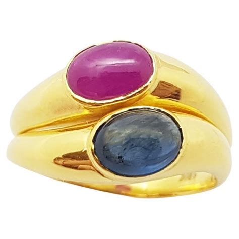 Cabochon Blue Sapphire With Ruby Ring Set In 18 Karat Gold Settings At