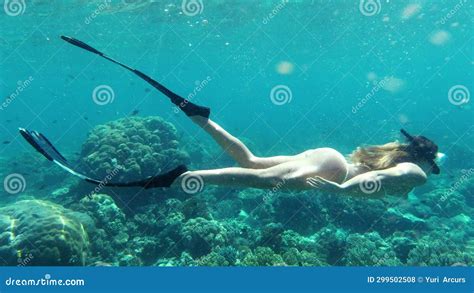 Woman Snorkelling Or Swimming In Coral Reef In Ocean Nature Or Fish