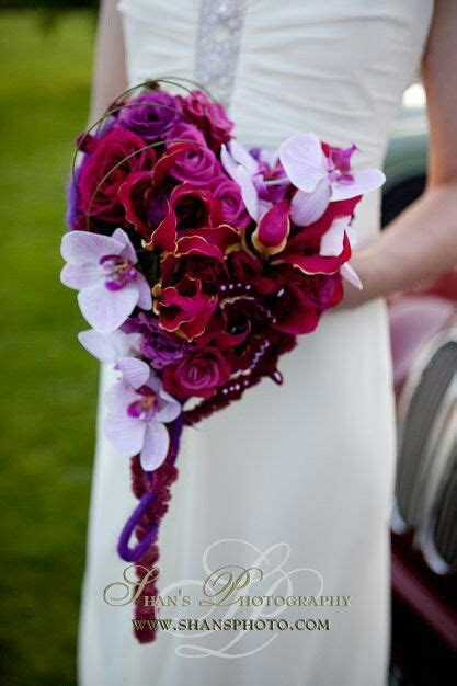 Heart Shaped Bridal Bouquet Made Up Of Purple Fuchsia Magenta Roses