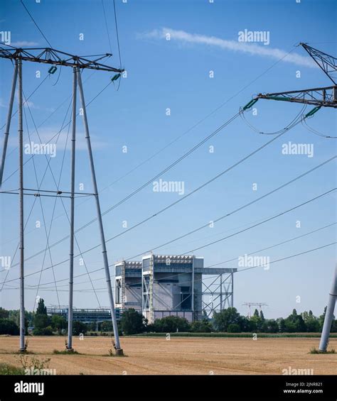 Pylons And Cables Carry Electricity From A Nuclear Power Plant In The