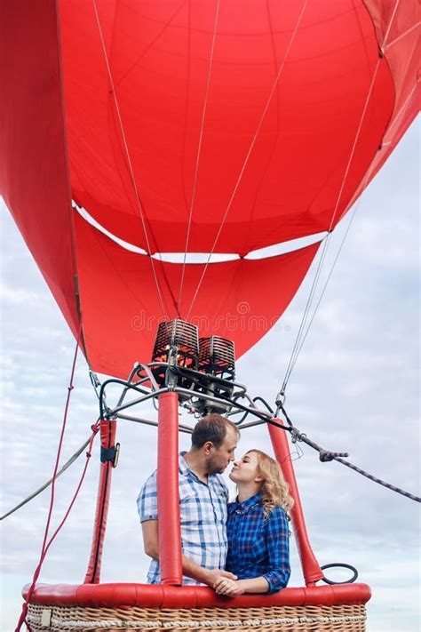 Beautiful Romantic Couple Hugging At Meadow Hot Air Balloon On A