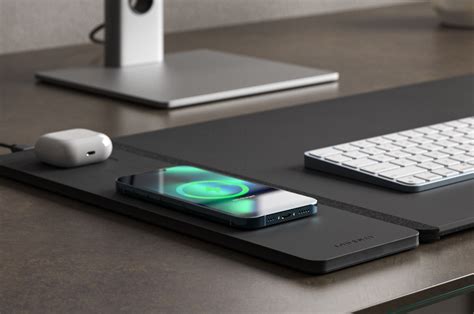 A Desk Mat That Charges Your Phone And Hides Papers Is Perfect For A