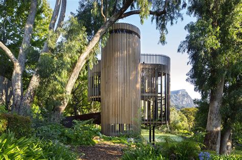 This contemporary treehouse-inspired cabin is a playful composition ...