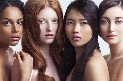 Multi Ethnic Nude Women Posing Together Stock Photo