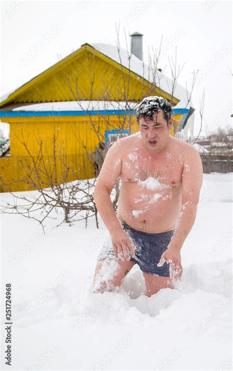 fat man bathing in the snow after a bath Stock Photo | Adobe Stock