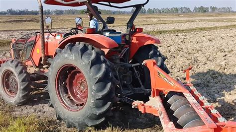 Amazing Tractor Kubota M6040 SU Ploughing The Field At Country Side