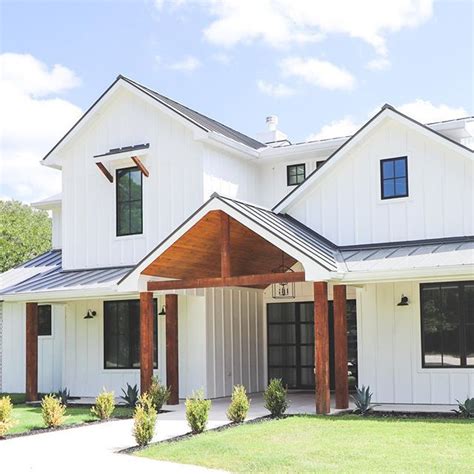 View 21 White House With Black Windows And Wood Accents - greatcentralpic