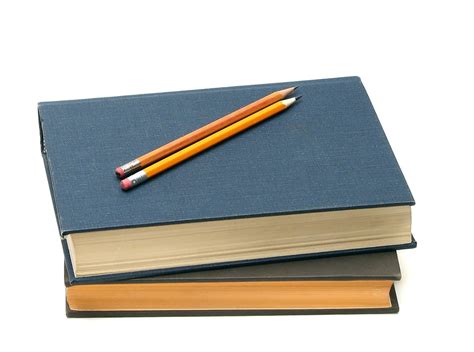 Books Free Stock Photo A Stack Of Books And Pencils Isolated On A