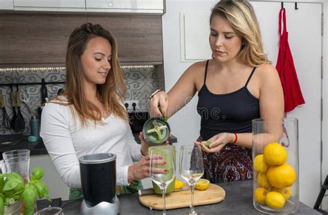 Vegan Lesbian Couple Preparing Spinach Smoothie LGTB Concept Vegan People Stock Photo Image