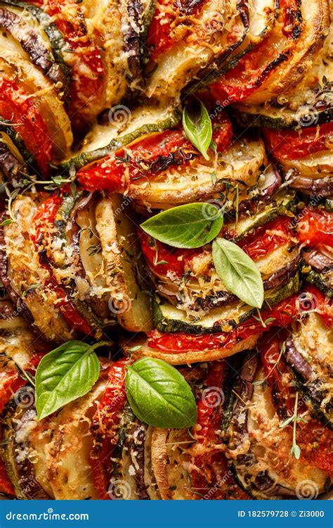 Tian Provencal Casserole With A Variety Of Vegetables Sprinkled With Cheese And Herbs Stock