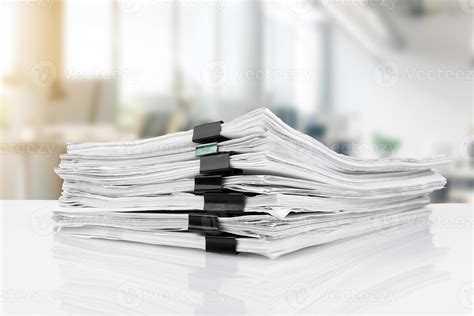 Stacks of papers on the desk in the office. business office 17644412
