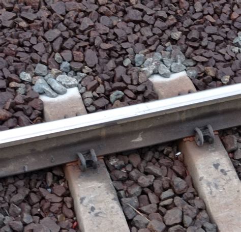 rail - Why railroad concrete tie tips become dry first after a rain ...