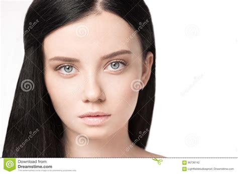 Attractive Brunette Woman With Perfect Skin Looking At Camera Stock