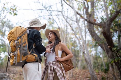 Cheerful Romantic Lesbian Couple Traveler With Backpack On Their Backs