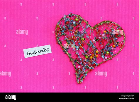 Bedankt Thank You In Dutch With Heart On Vivid Pink Surface Stock