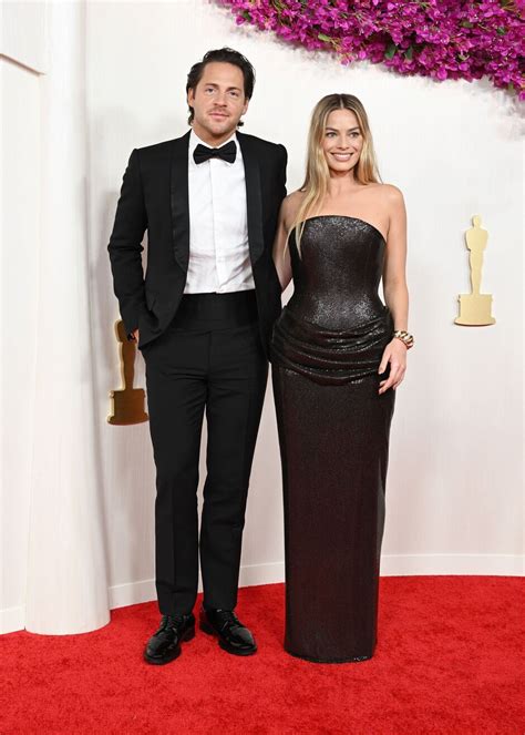 Margot Robbie Fans Claim Stunning Oscars Gown Was Protest Dress At