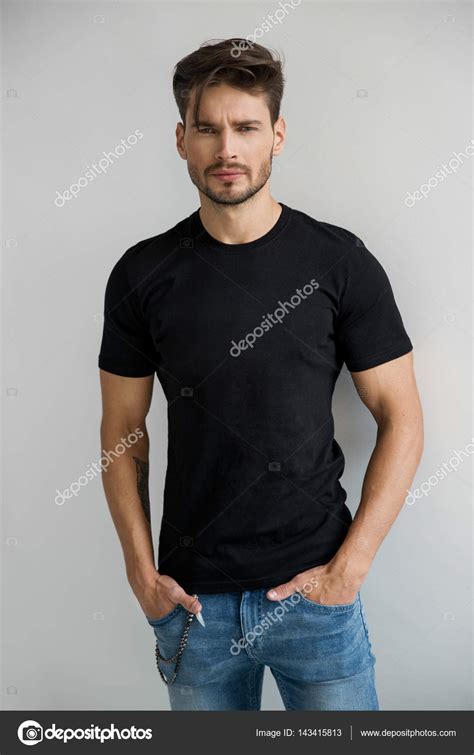 Man In Black T Shirt Looking At Camera Stock Photo By Kiuikson 143415813