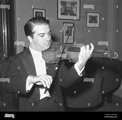 Violinist Ruggiero Ricci rehearses before concert. Prague, Czechoslovakia 1958. (CTK Photo ...