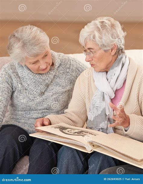 Some Memories Never Fade Seniors Looking Through A Photo Album Stock