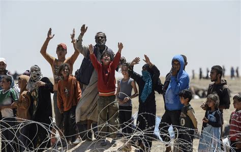 Syrian Refugees Crash Through Turkish Border Fence The Atlantic