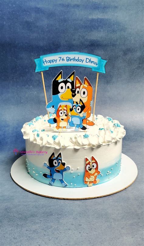 A Birthday Cake With Cartoon Characters On It