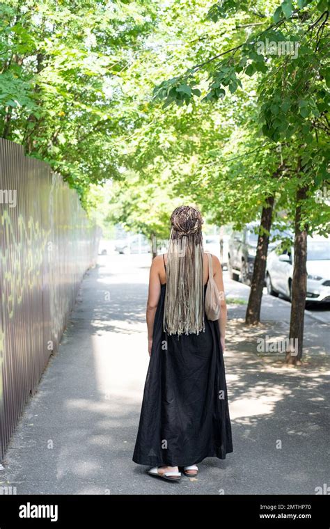 Beautiful Woman In Black Dress Walks Back Hi Res Stock Photography And