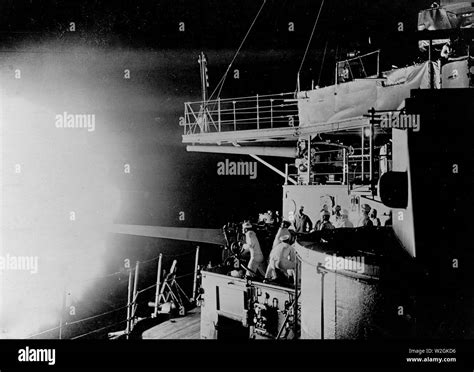 Battleship firing hi-res stock photography and images - Alamy