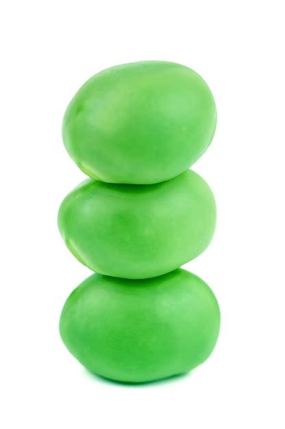 Premium Photo Stack Of Green Pea On White Background