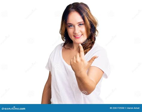 Young Beautiful Caucasian Woman Wearing Casual White Tshirt Beckoning