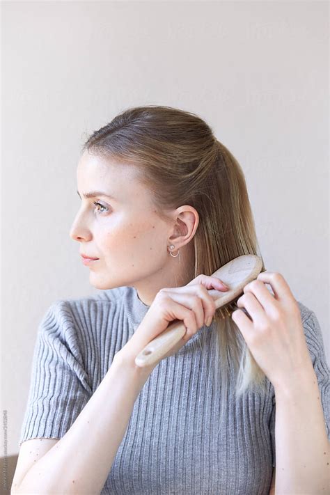 Woman Brushing Her Hair