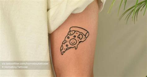 Pizza slice tattoo located on the upper arm.