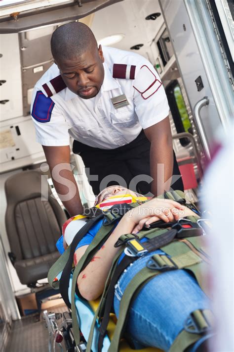 Paramedic Emergency Medical Technician Comforting Accident Vict Stock