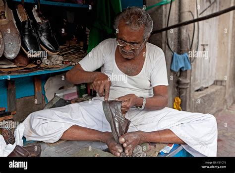 India Maharashtra Mumbai Traditional Pavement Cobbler Repairing